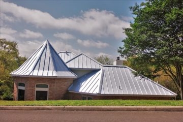 Steel Roof On Brick Home With Turret Design