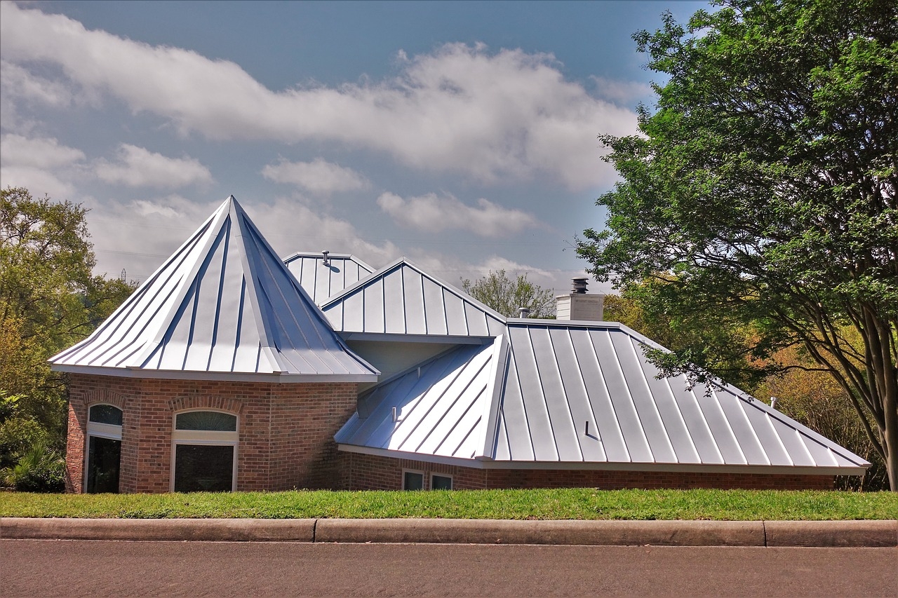 Steel Roof On Brick Home With Turret Design