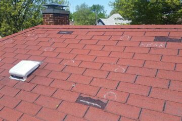 Hail Damage On A Red Asphalt Roof