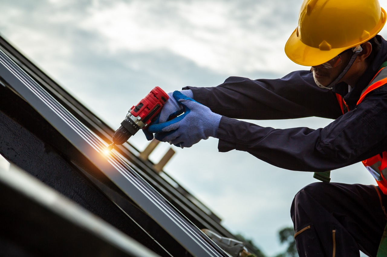 professional working on repairing the roof